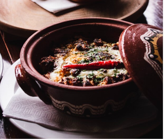 Flavorful and tempting dish served in Clay pot Bowl