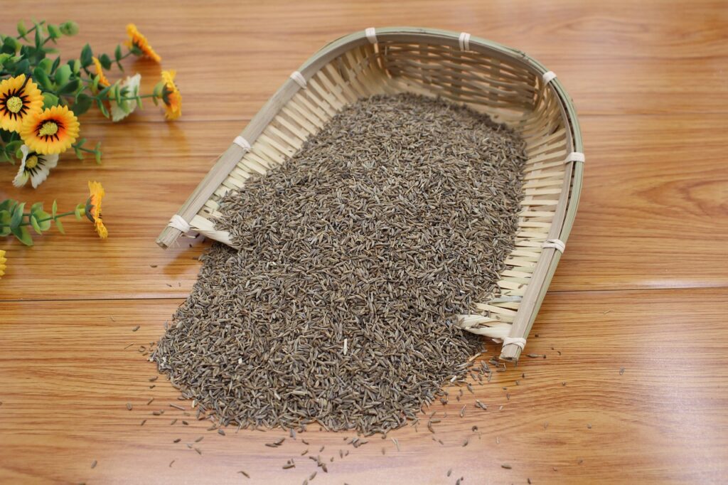 Cumin seeds in traditional bamboo spice strainer